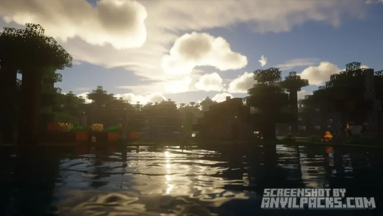 Golden sunset over a lake with detailed water reflections and silhouettes of trees.