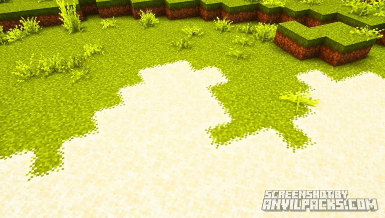 Close-up of grass block texture showing irregular pixelated overlay spilling onto sand surface.